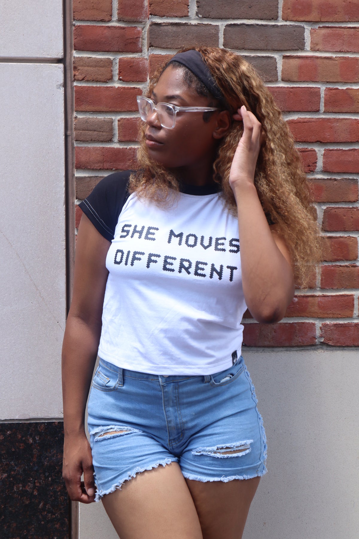 “SHE MOVES DIFFERENT” Cropped Raglan Tee